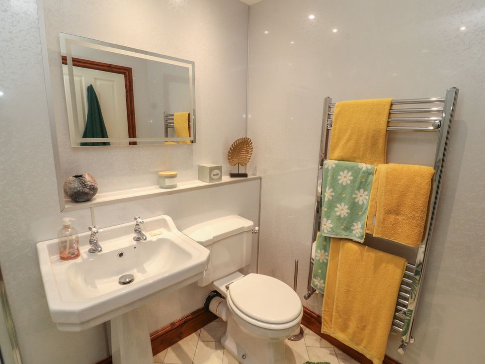 A bathroom with a sink and toilet at 30 George Street Wigton