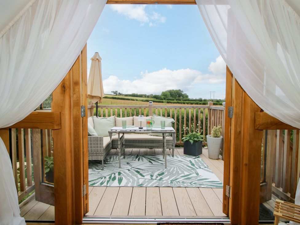 A terrace with seating and a view at Little Acre in Leominster
