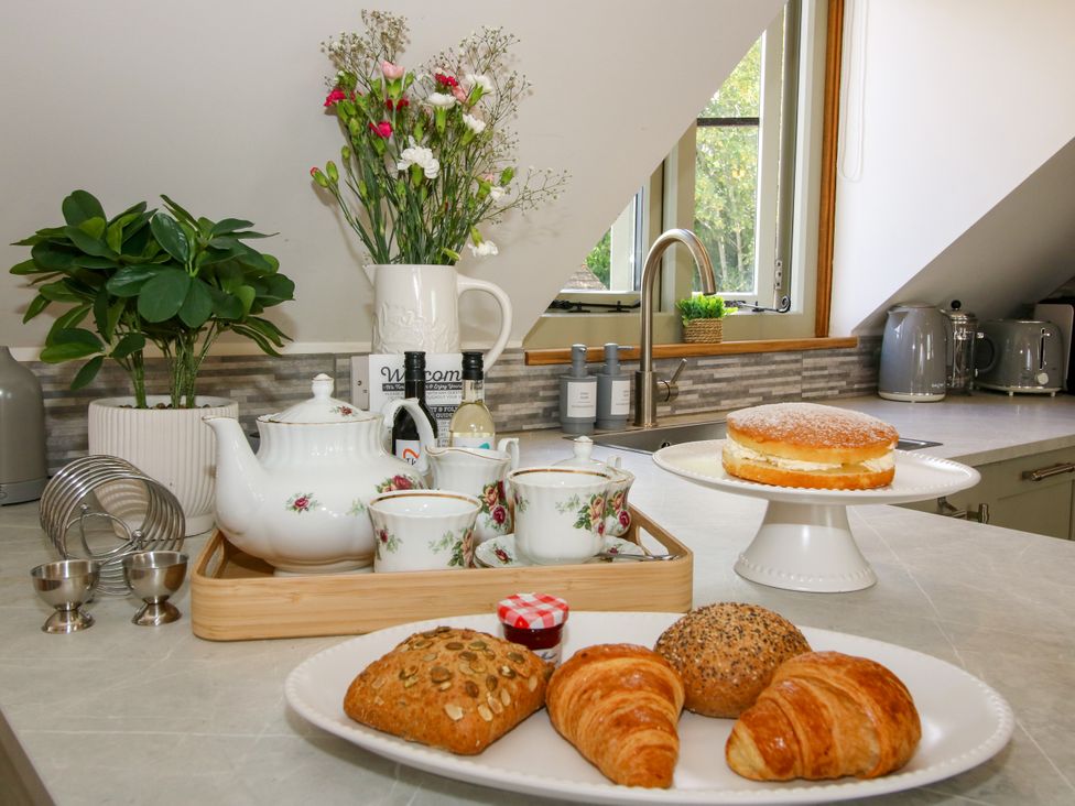 A kitchen with baked goods and tea set at Little Acre in Leominster