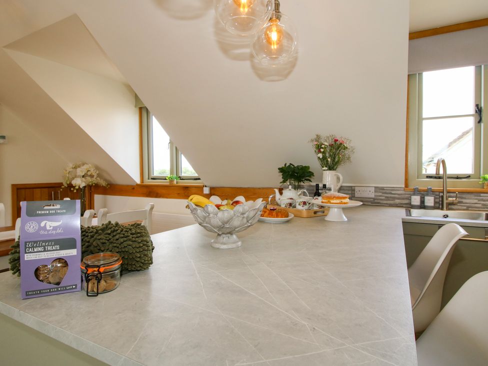 A kitchen with a countertop fruit bowl and sink at Little Acre in Leominster