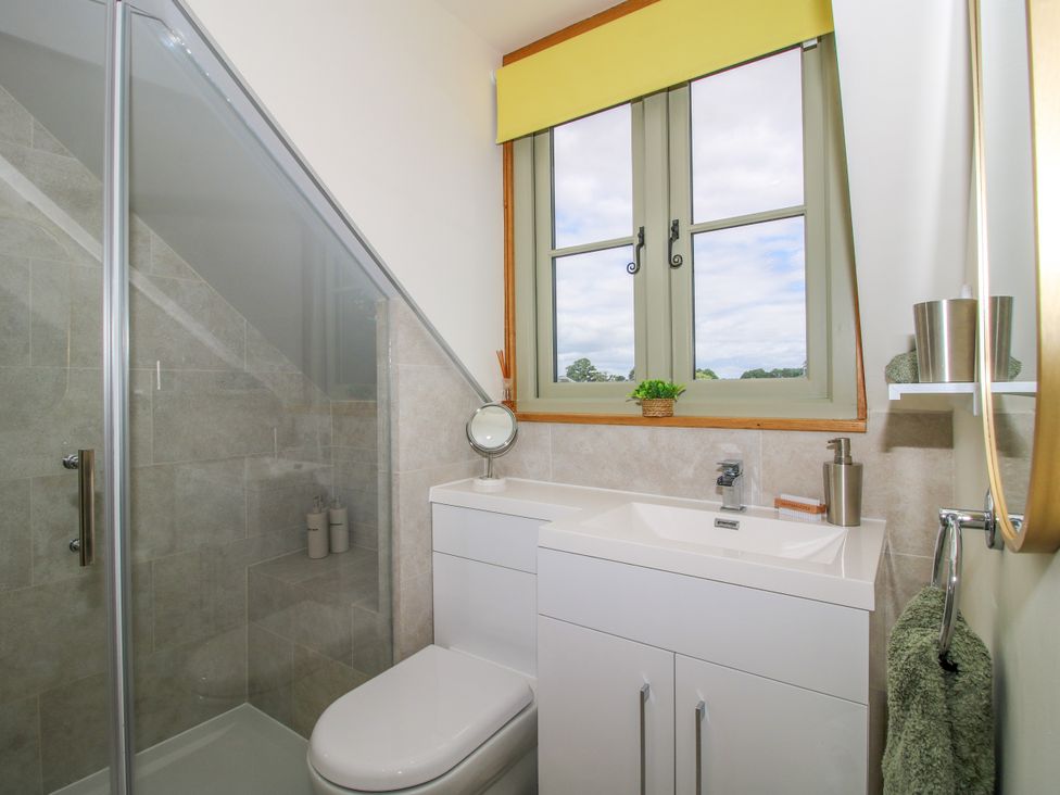 A bathroom with a shower and sink at Little Acre in Leominster