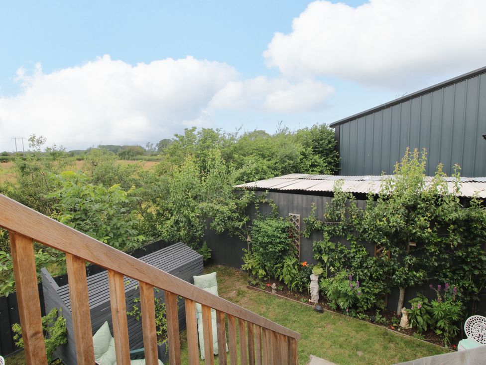 A garden with plants and steps at Little Acre in Leominster