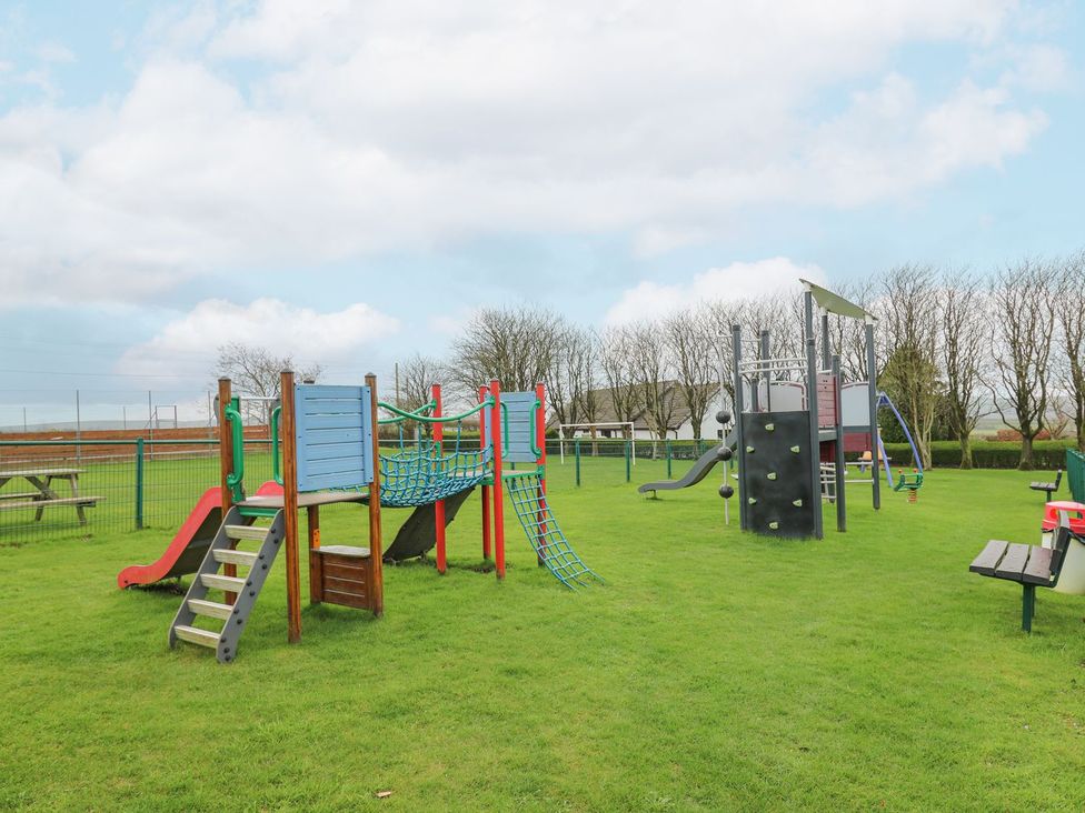 A playground with climbing frames and slides at The Dorchester at Bay View, Maen-y-groes near New Quay