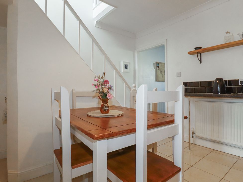 A dining room with a table and chairs at 39 Southgate Street