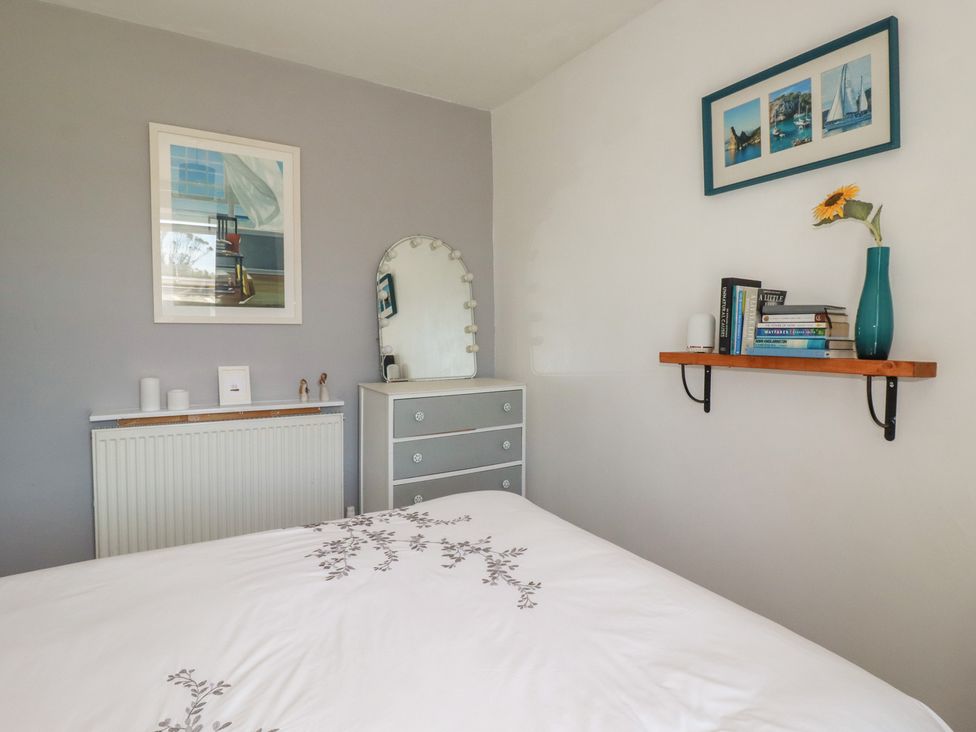 A bedroom with a bed and dresser at 39 Southgate Street