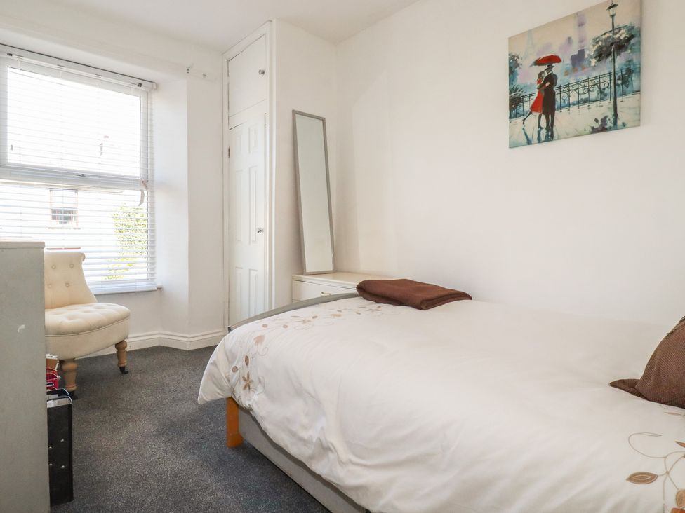 A bedroom with a bed and chair at 39 Southgate Street