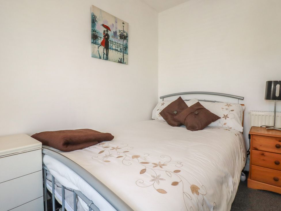 A bedroom with a bed and bedside table at 39 Southgate Street
