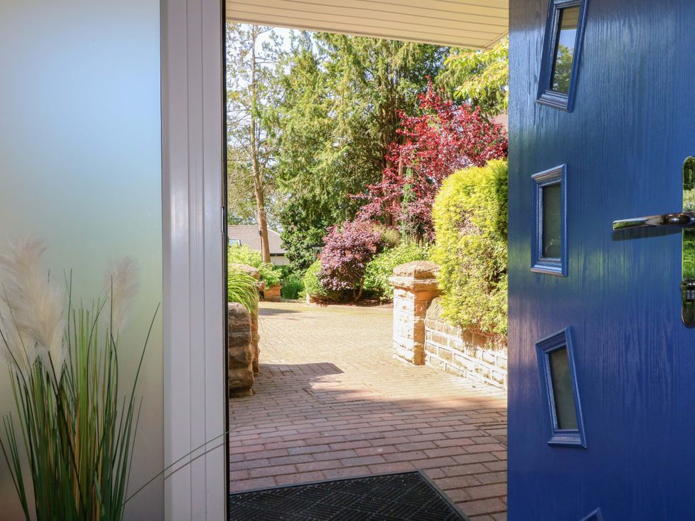 A view of a garden from an open door at Elmcroft in Nottingham