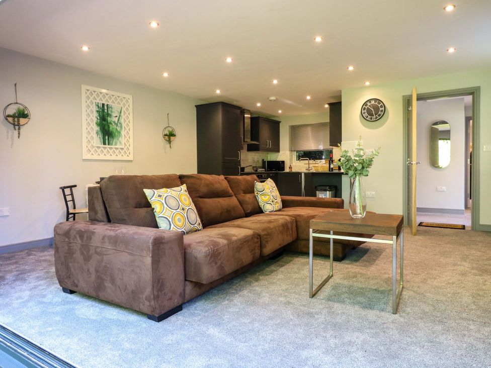 A living room with a sofa and coffee table at Elmcroft in Nottingham