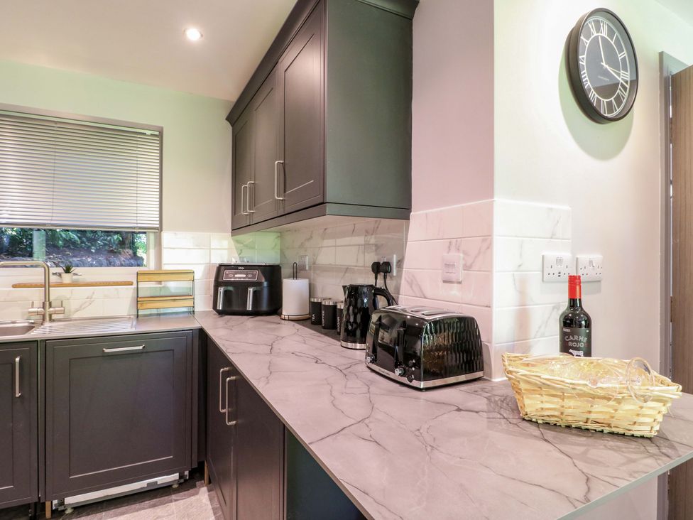 A kitchen with appliances on the countertop at Elmcroft in Nottingham