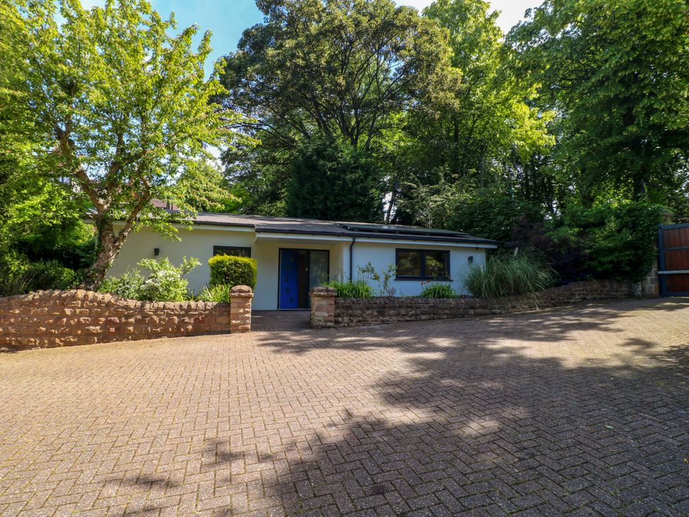 A house with a driveway and garden at Elmcroft in Nottingham
