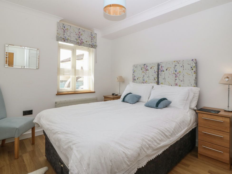 A bedroom with a bed and furniture at Hillside 