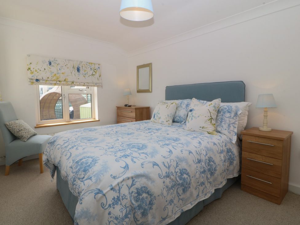 A bedroom with a bed and a chair at Hillside