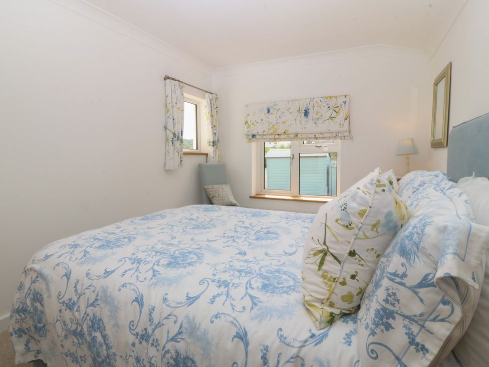 A bedroom with a bed and window at Hillside