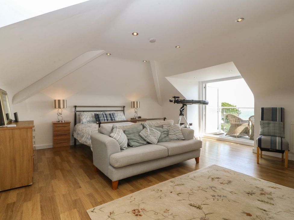 A bedroom with a bed and telescope at Hillside