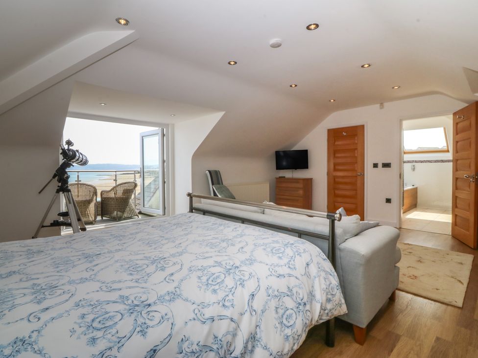 A bedroom with a bed and telescope at Hillside