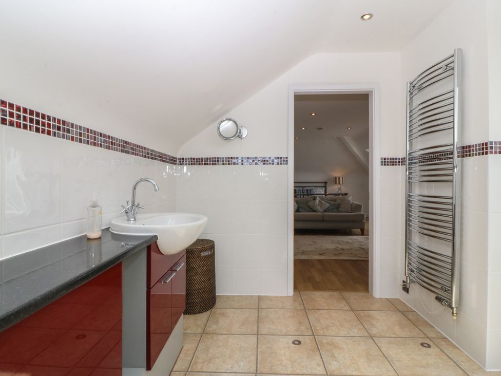 A bathroom with a sink and towel radiator at Hillside