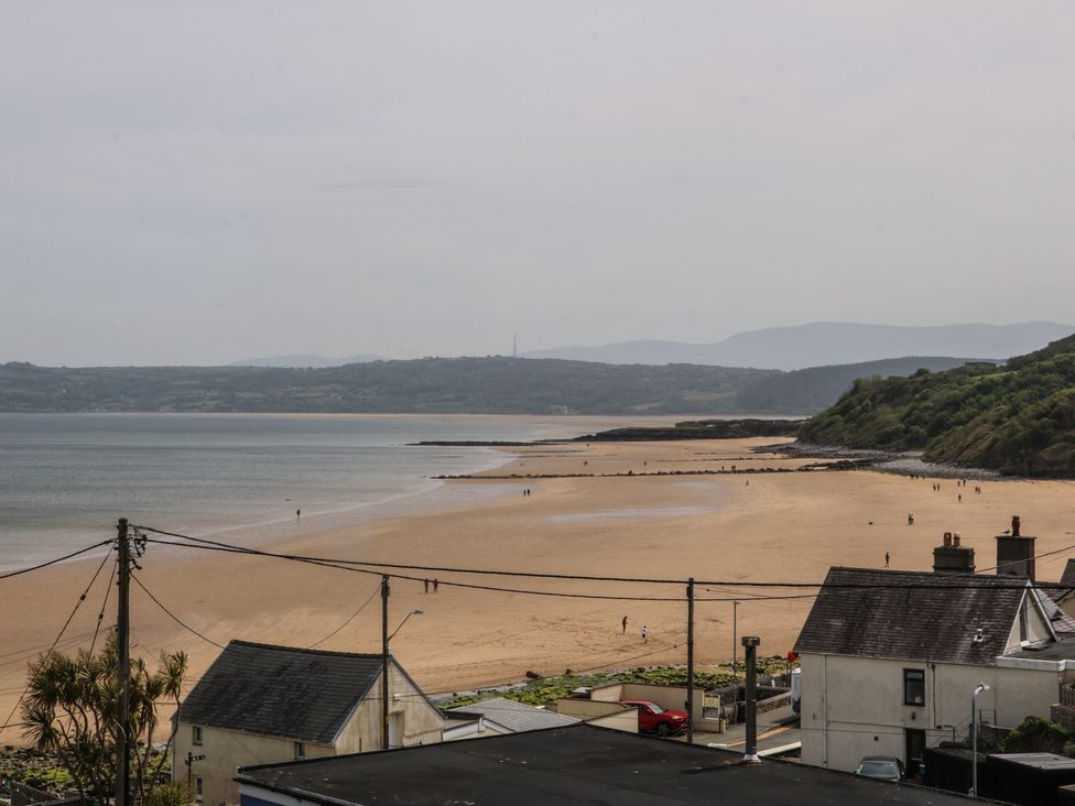 A beach view with hills in the background at Hillside