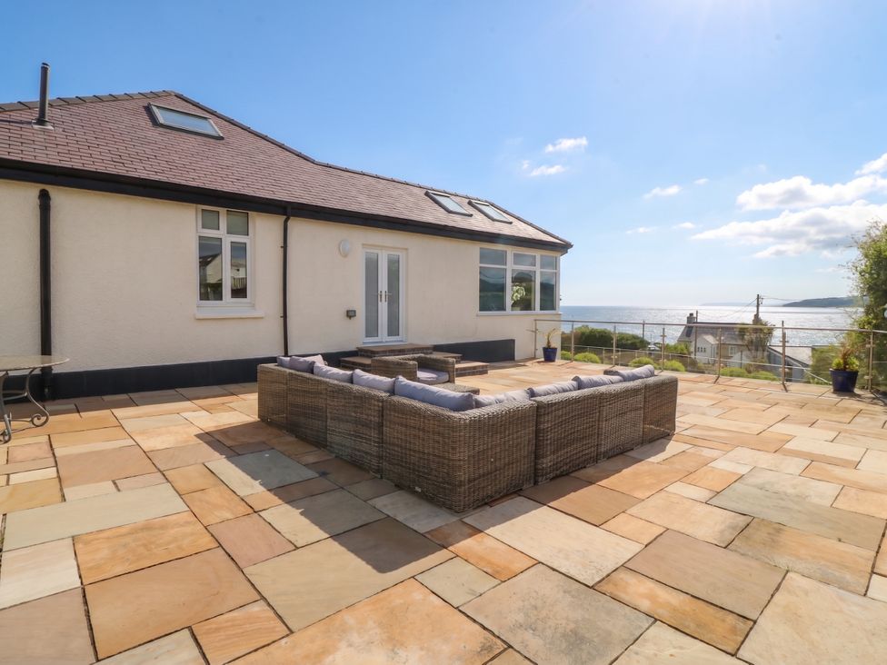 An outdoor area with a seating arrangement and ocean view at Hillside