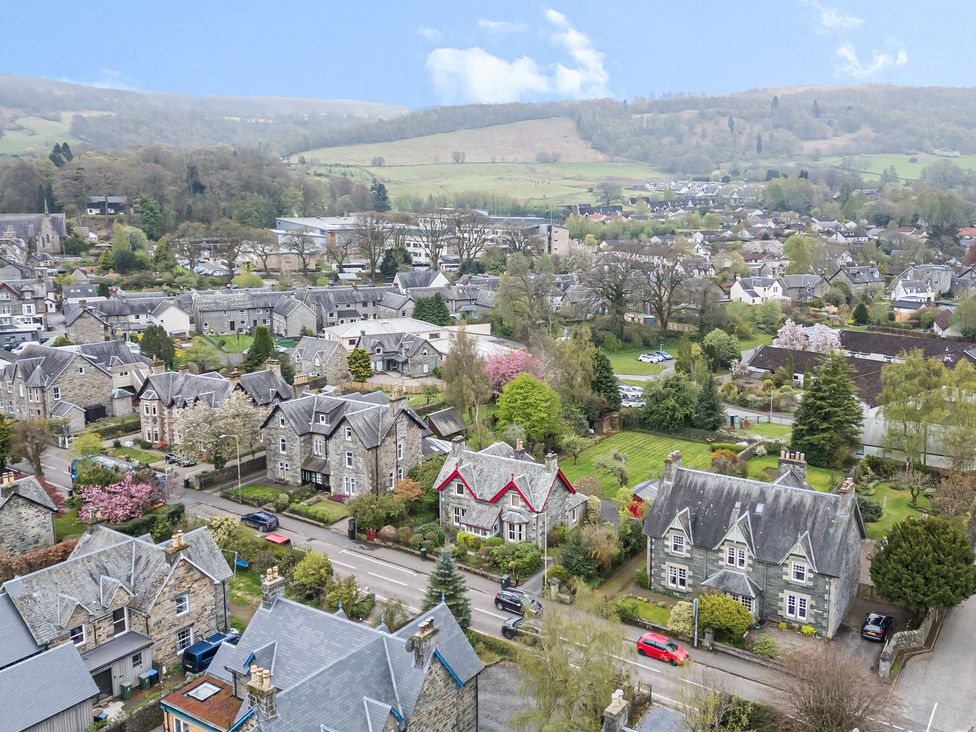 An aerial view of houses and trees in a residential area at Edengrove Aberfeldy