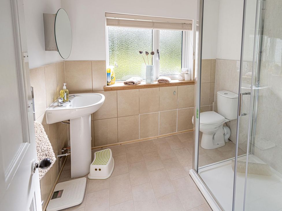 A bathroom with sink, toilet, and shower at Edengrove in Aberfeldy
