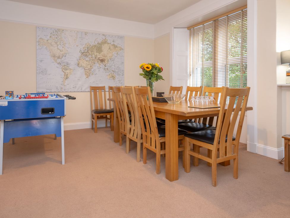 A dining room with a table and chairs at Edengrove in Aberfeldy