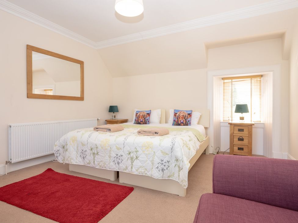 A bedroom with a double bed and side tables at Edengrove in Aberfeldy