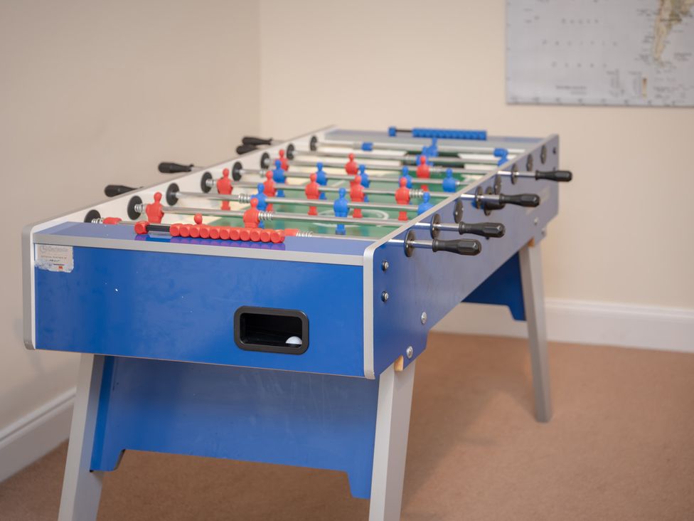 A foosball table in a game room at Edengrove in Aberfeldy