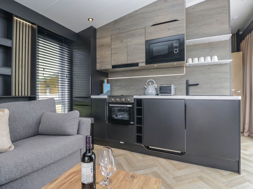 A kitchen with a countertop and appliances at Heron in Haverigg