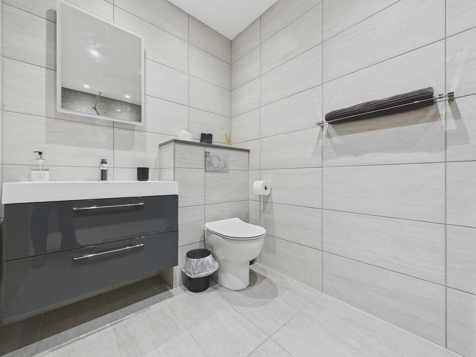 A bathroom with sink and toilet at Oakwood House in Tansley near Matlock