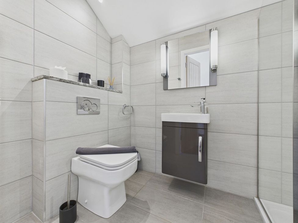 A bathroom with toilet and sink at Oakwood House in Tansley near Matlock