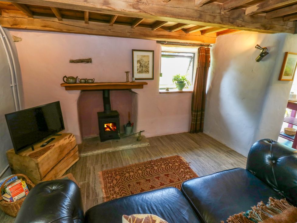 A living room with a sofa and television at The Brew House in Penrith