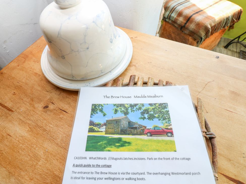 A kitchen with a cloche and a guide to The Brew House in Penrith