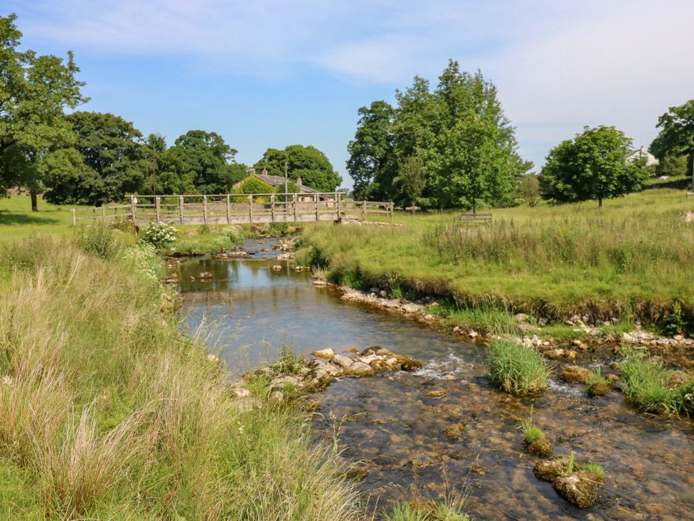 A stream with nearby grass and trees at The Brew House in Penrith