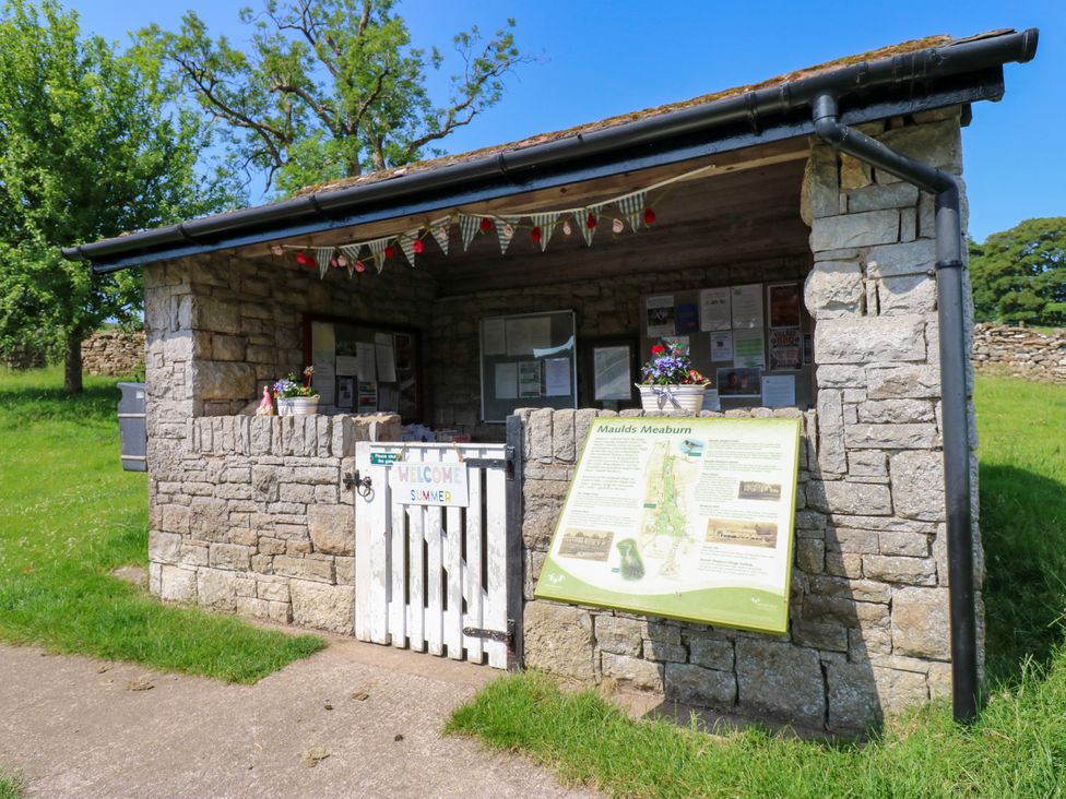 A stone building with a gate and signage at The Brew House in Penrith