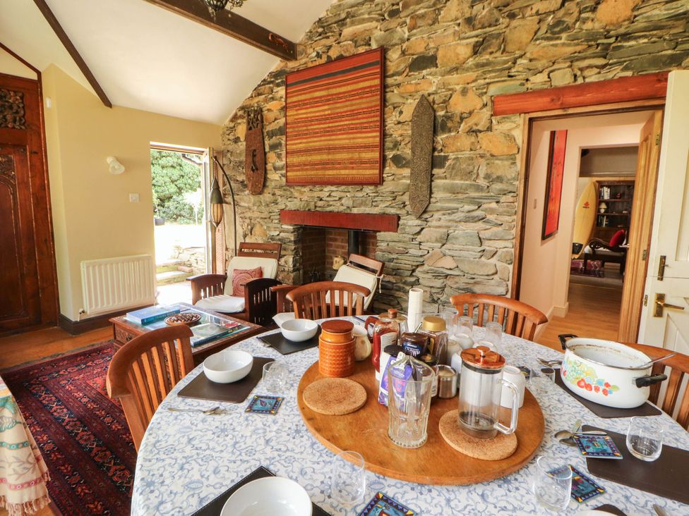A dining room with a table set for a meal at The School House in Penrith