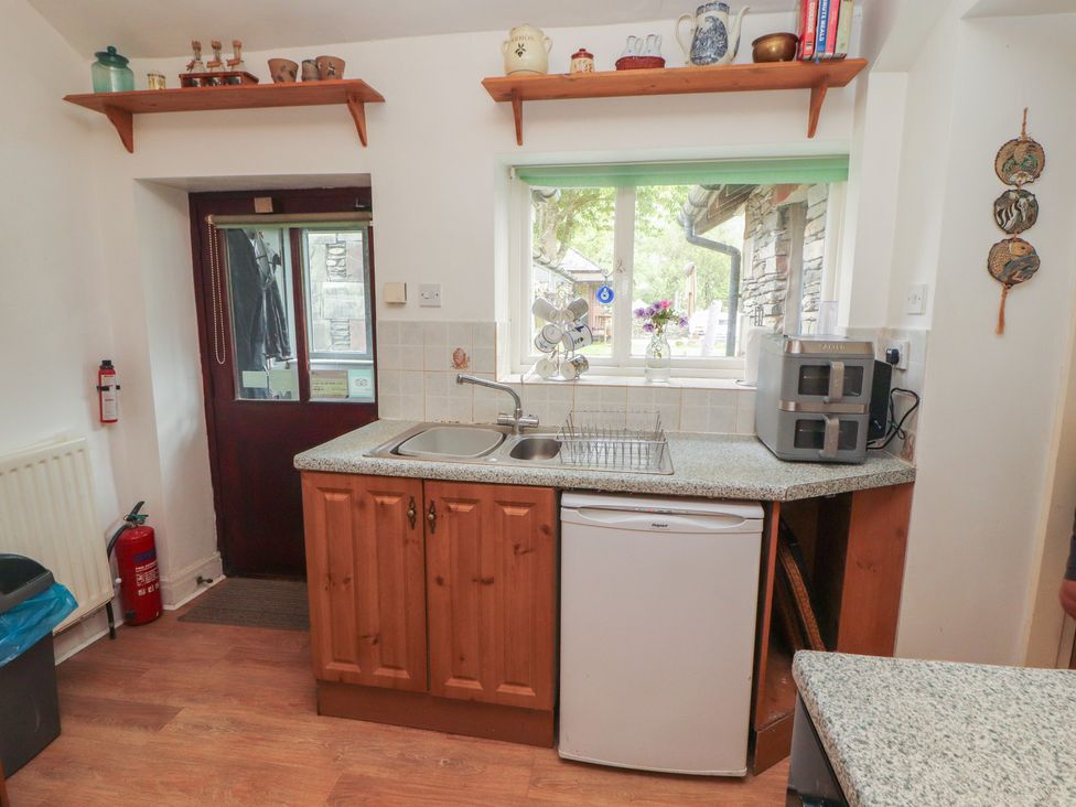 A kitchen with a sink and appliances at The School House in Patterdale near Glenridding