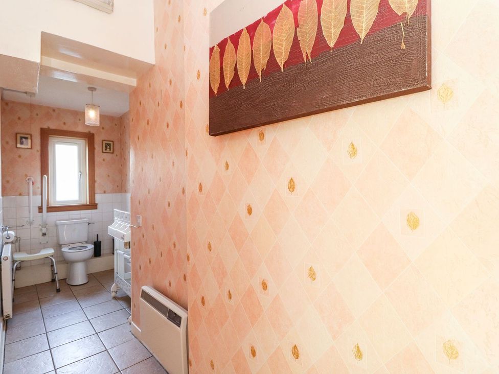 A bathroom with a toilet and sink at Seaview Wellness Retreat in Carnoustie