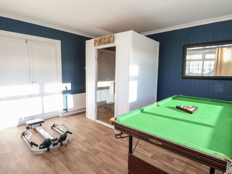 A recreation room with a pool table and exercise equipment at Seaview Wellness Retreat, Carnoustie