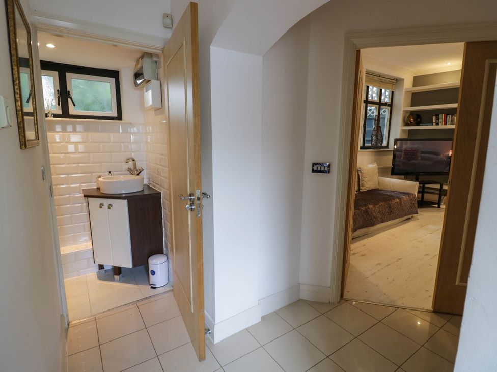 A bathroom with a sink and toilet at Tudor Lodge in Birmingham