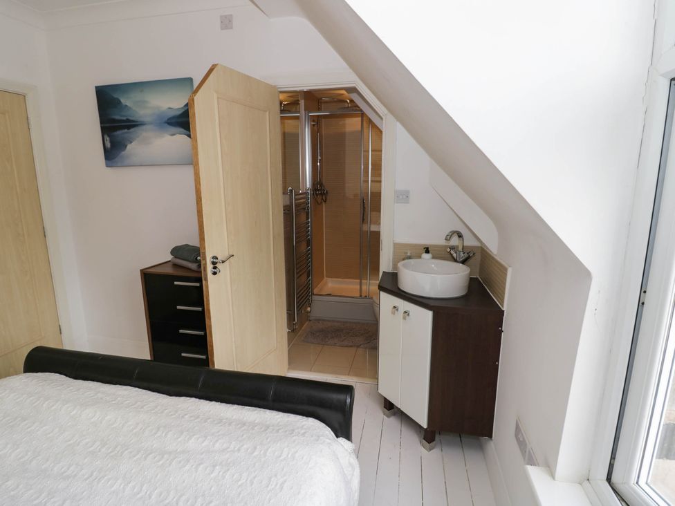 A bathroom with a shower and sink at Tudor Lodge in Birmingham