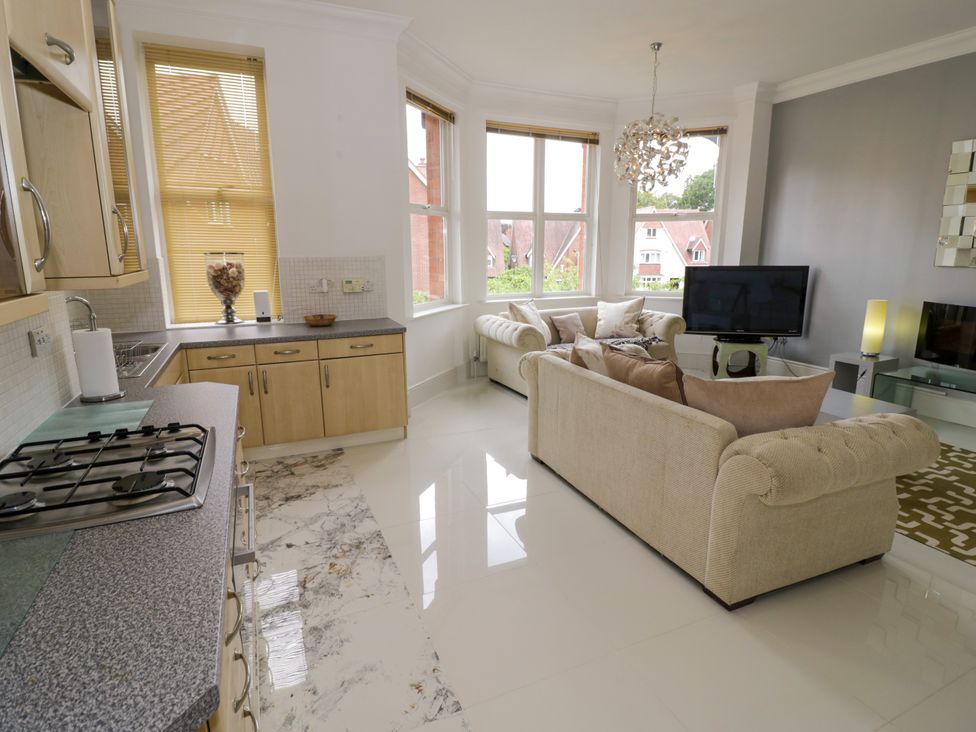 A living room with a sofa and television at Manor House in Birmingham