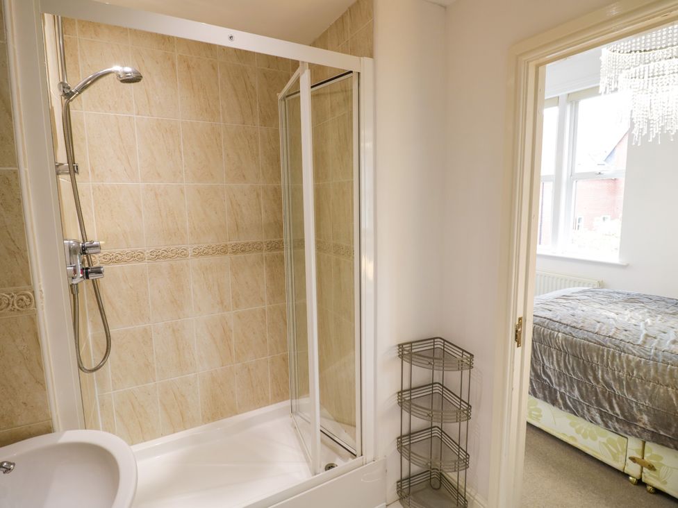 A bathroom with a shower and bathtub at Manor House in Birmingham