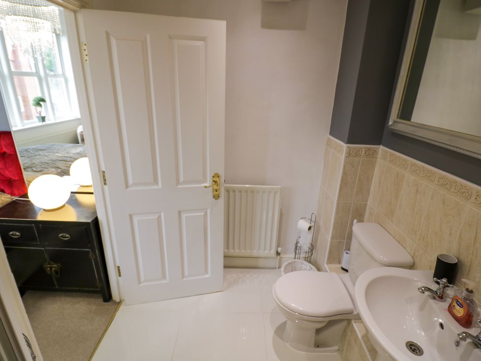A bathroom with a sink and toilet at Manor House in Birmingham