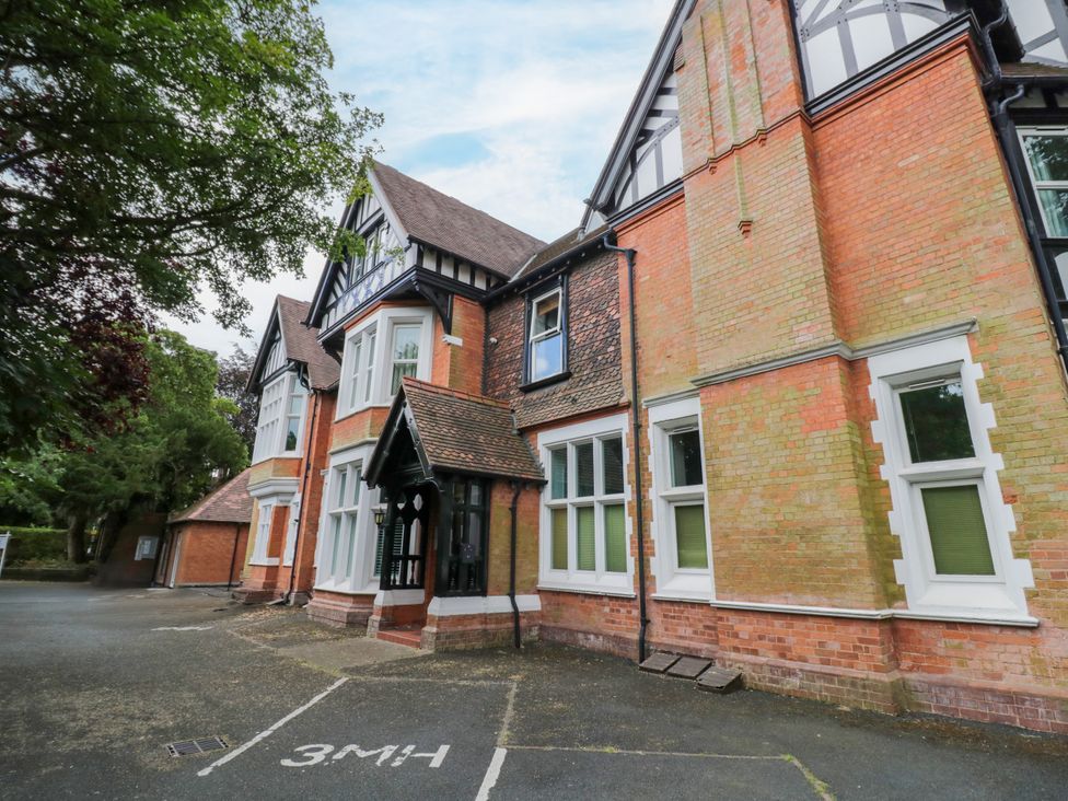 An exterior view of a building with windows and a door at Manor House in Birmingham