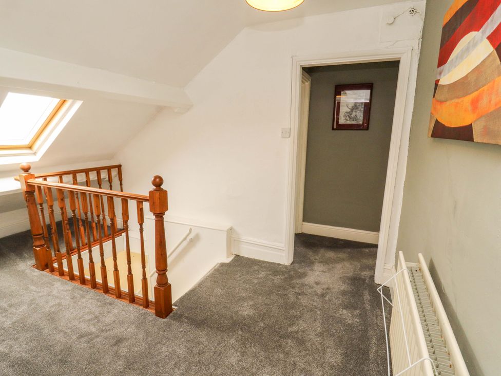 A landing with a skylight and staircase at The Loft Apartment @ The Stag Inn Maryport