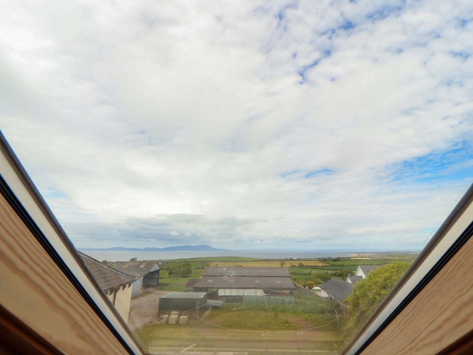 A view from a window showing buildings and landscape at The Loft Apartment @ The Stag Inn Maryport