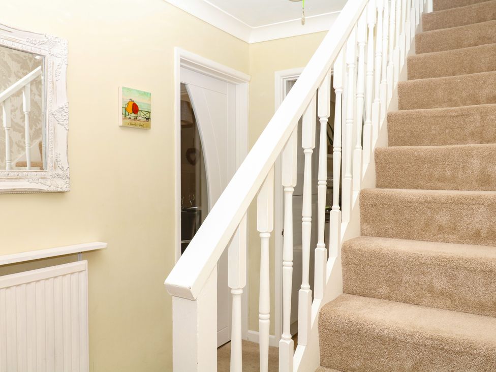 A staircase in a hallway at Marldon Mews in Marldon