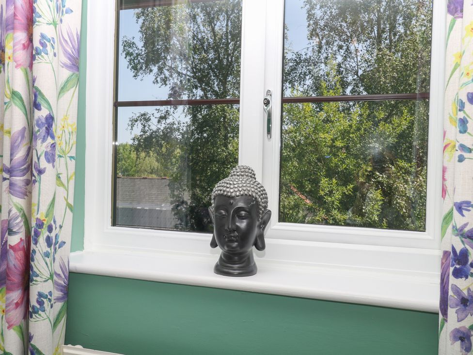 A Buddha statue on a windowsill at Marldon Mews in Marldon