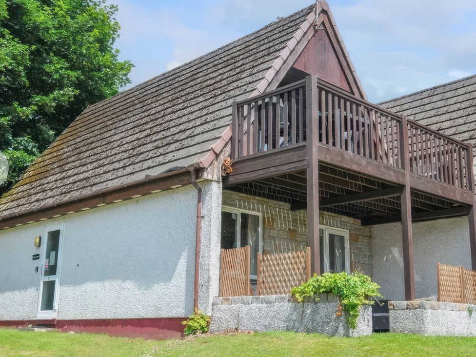 A house with a balcony and garden at 9 Honicombe Park in Callington